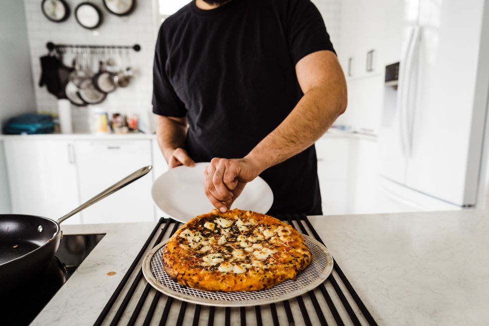 Man about to eat pizza at home