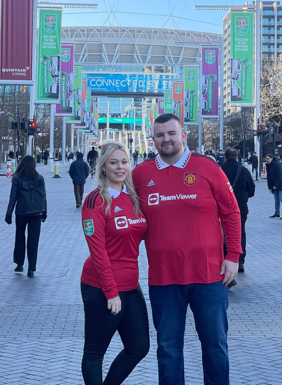 Man and fiance outside football game