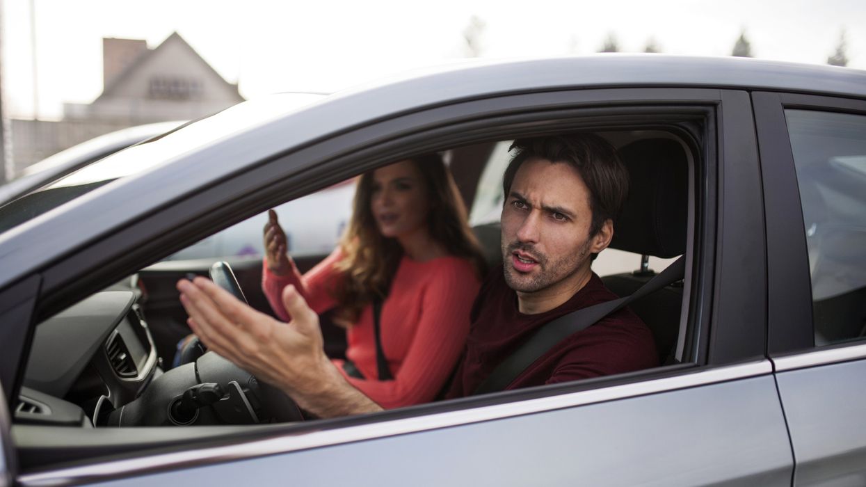 Man and woman arguing in a car
