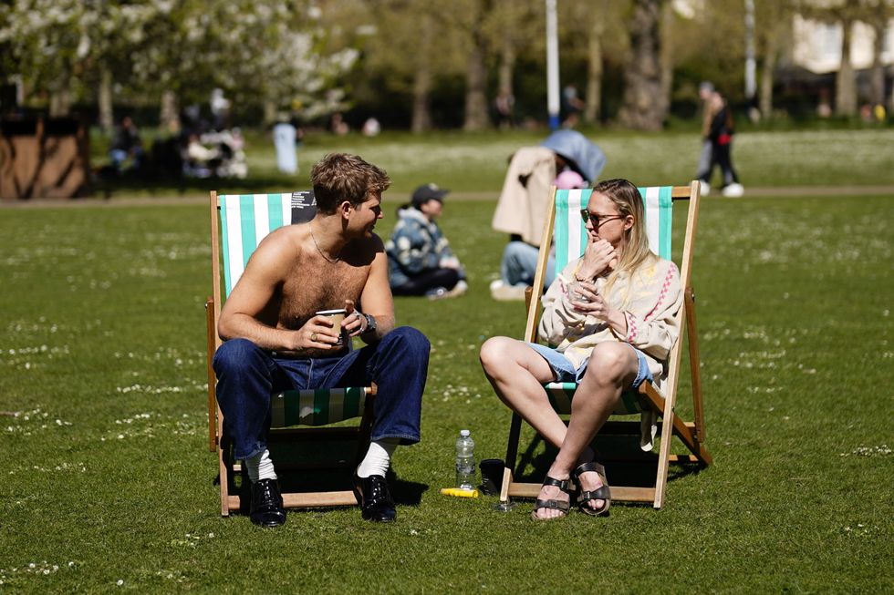 Man and woman sunbathing