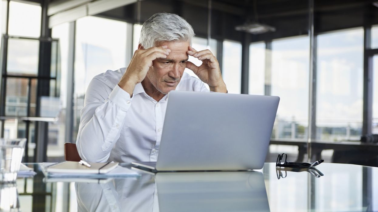 Man at laptop stressed
