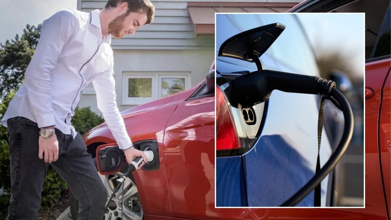 Man charging an electric car and an EV charger