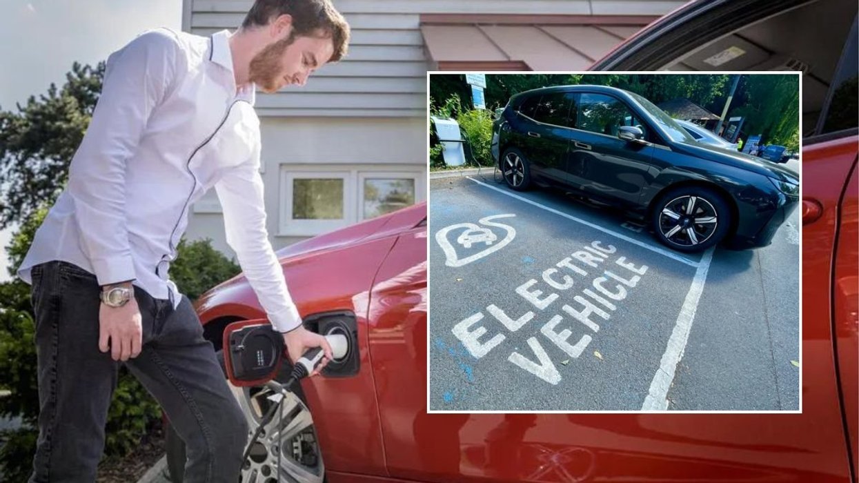 Man charging an electric car and an EV charging