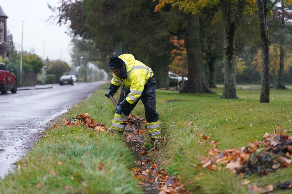 Man clears drainage ditch ahead of Storm Babet