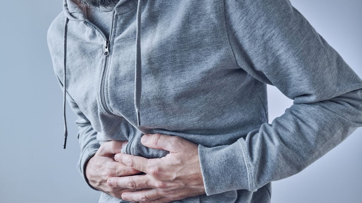 Man clutching stomach