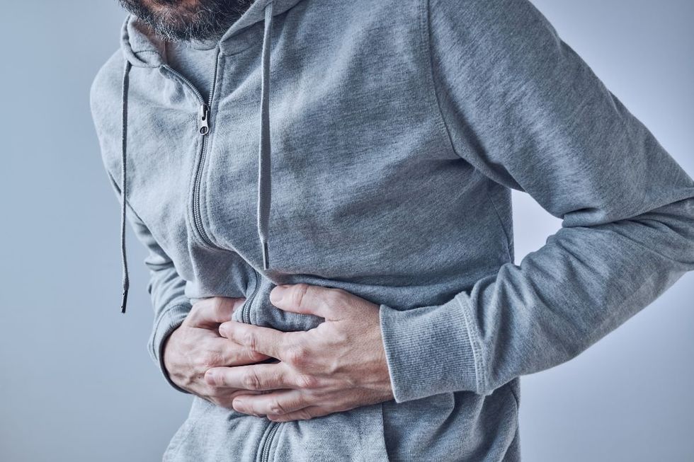 Man clutching stomach