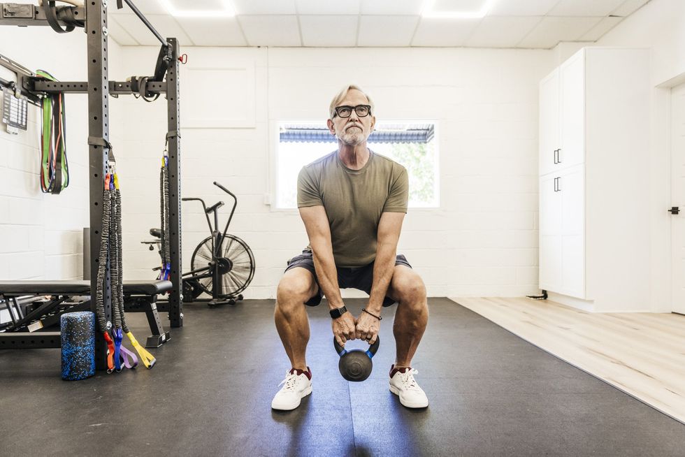 Man doing kettlebell exercises