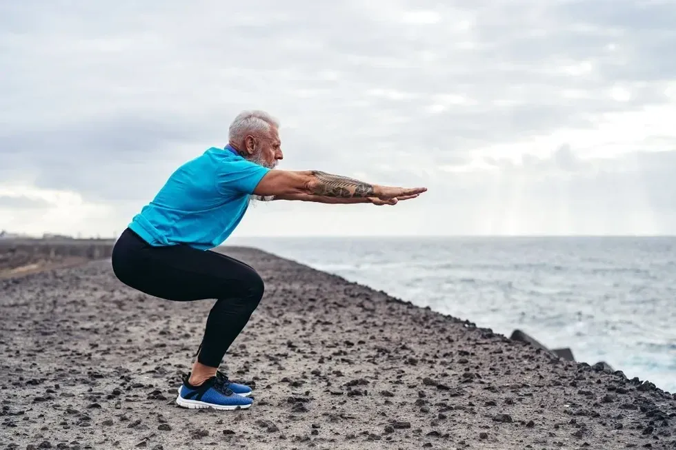 MAN DOING SQUAT