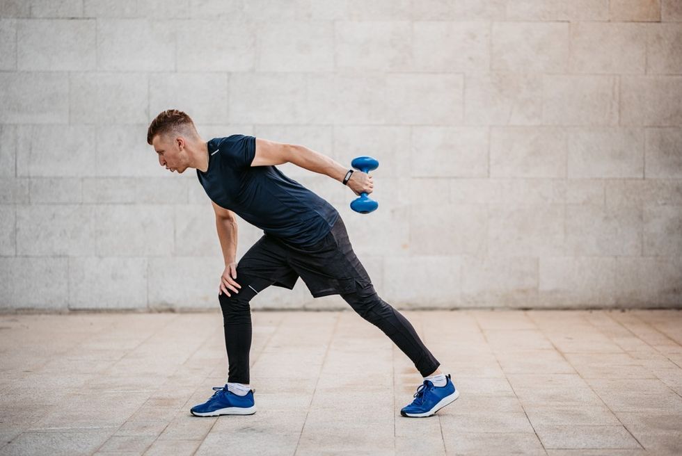 Man doing tricep kickbacks