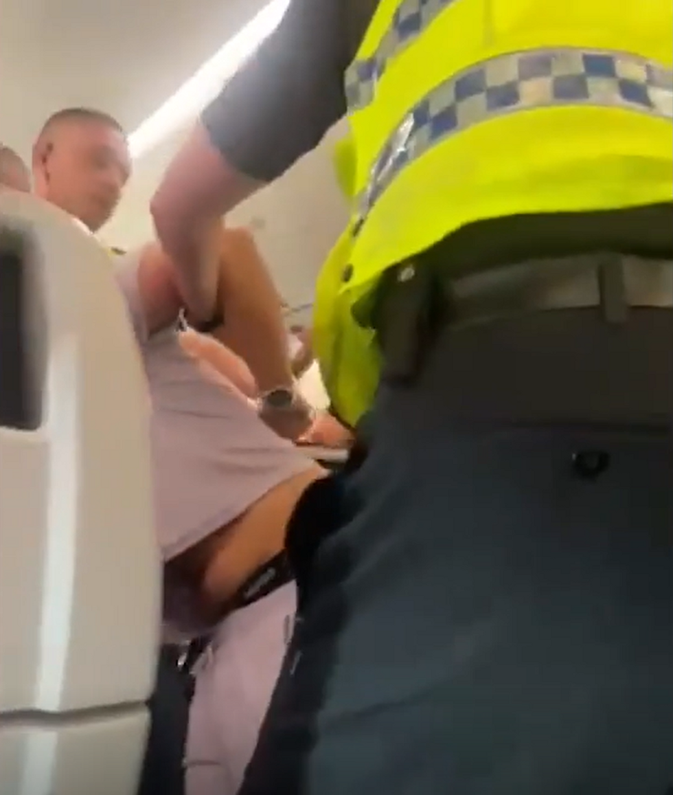 Man dragged off plane