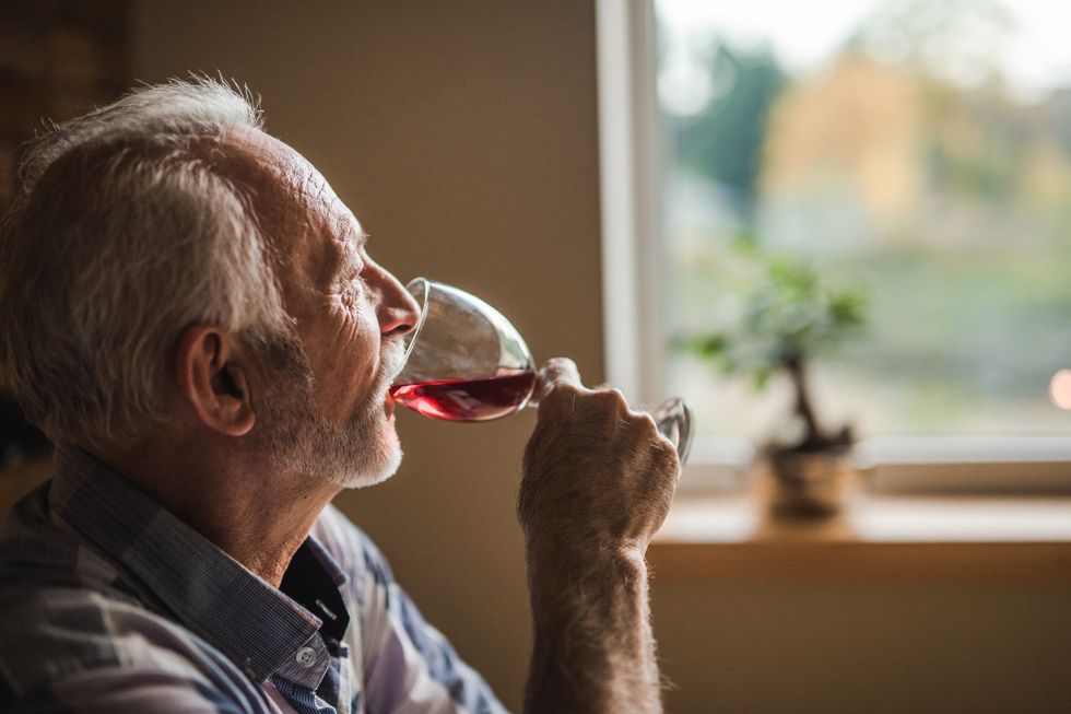 Man drinking a glass of wine