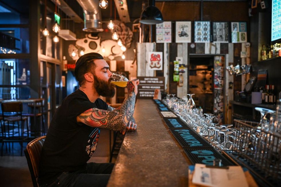 Man drinking beer at BrewDog pub