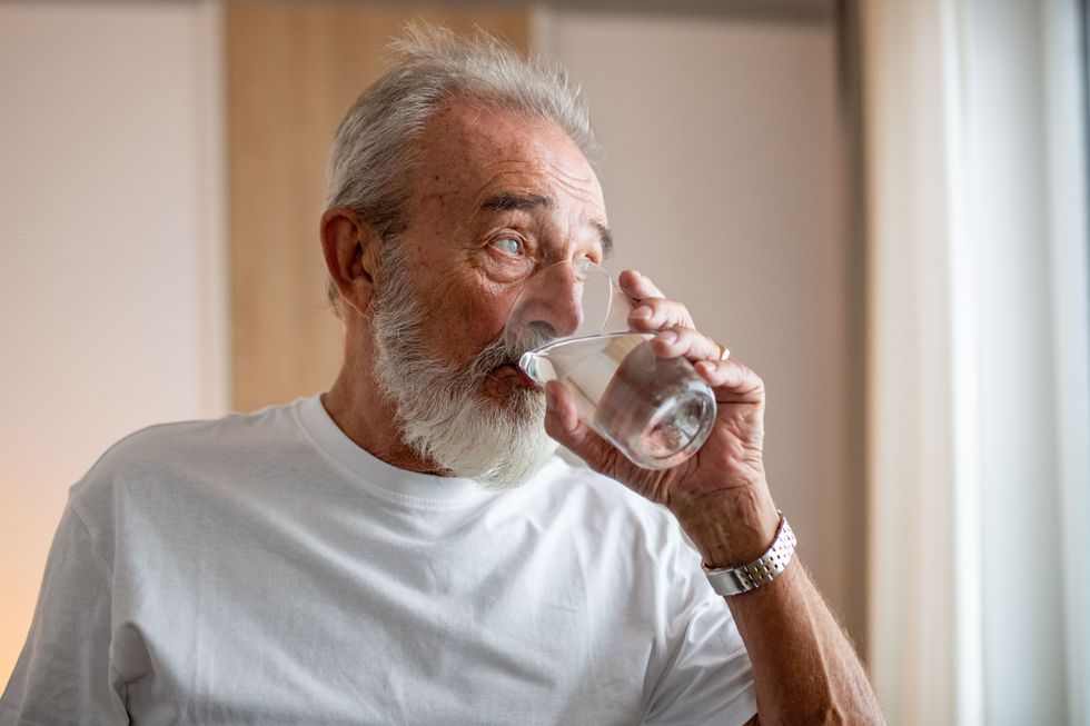 MAN DRINKING WATER