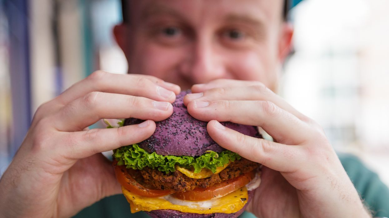 Man eating a vegan burger