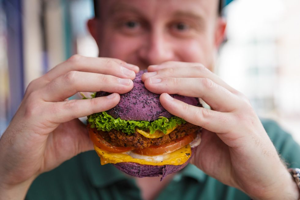 Man eating a vegan burger