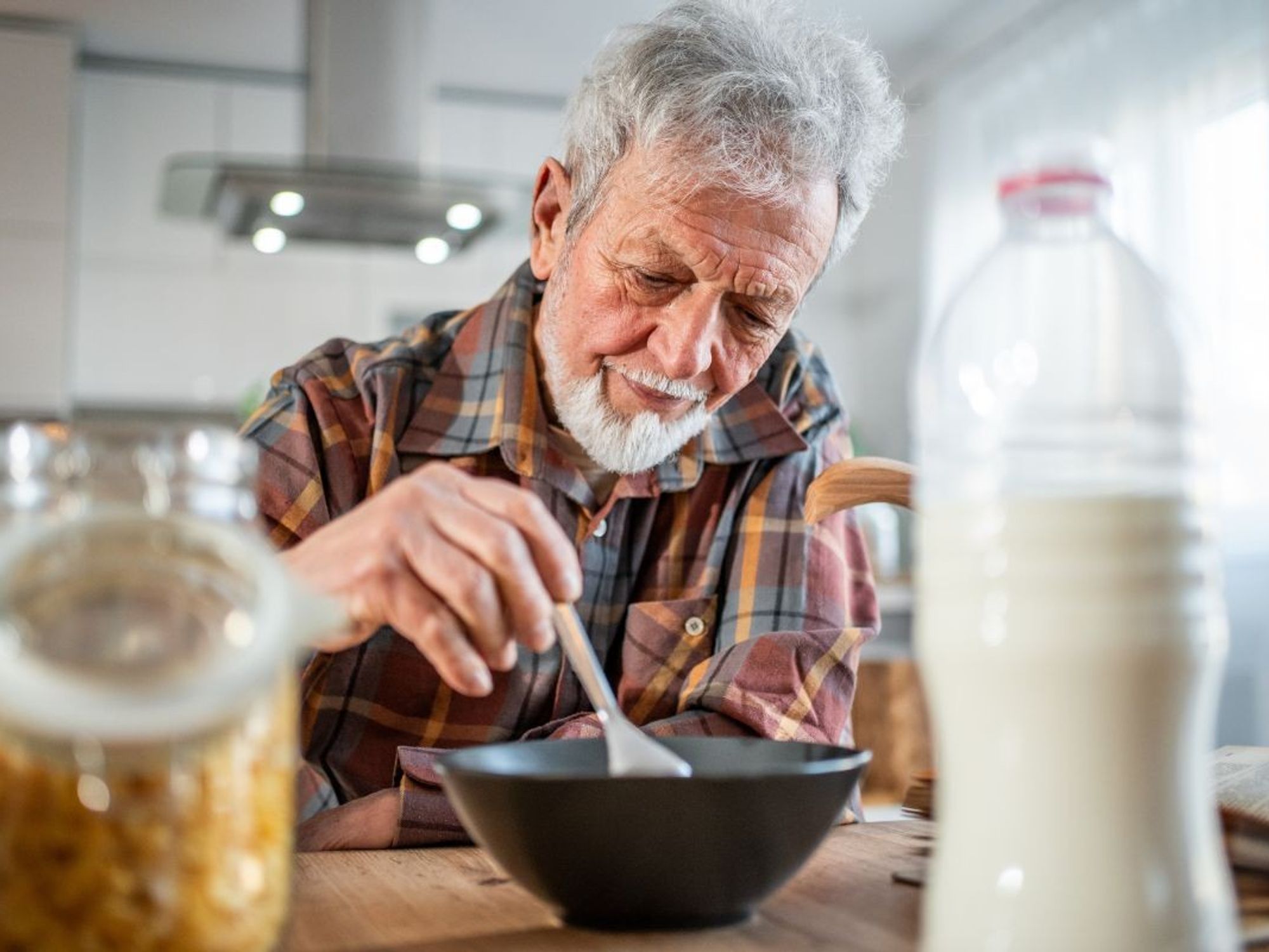 MAN EATING BREAKFAST