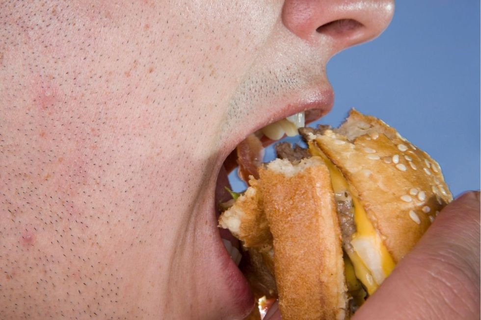 Man eating burger