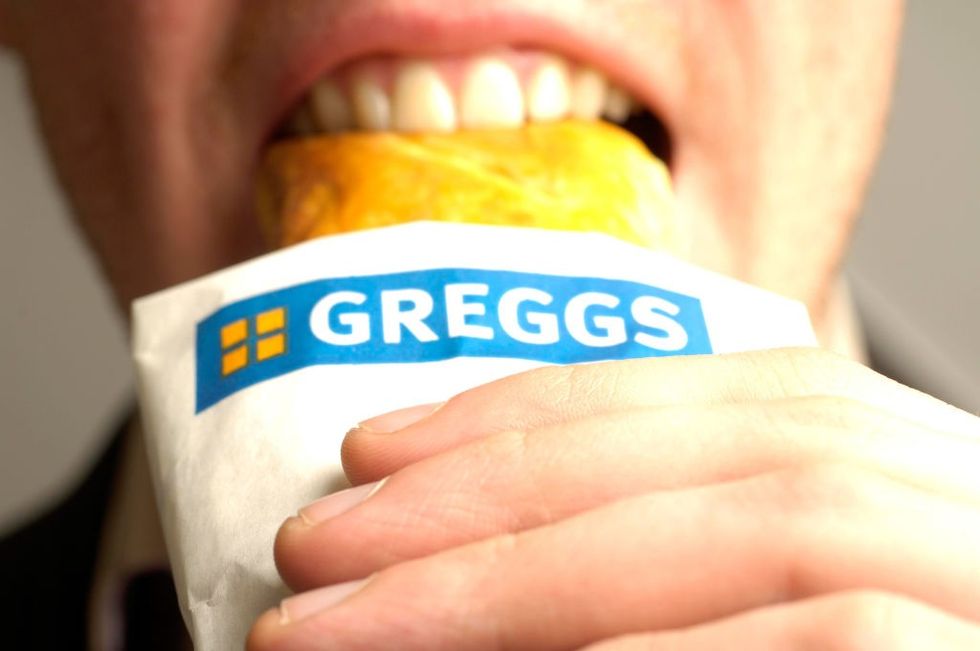 Man eating Gregs sausage roll