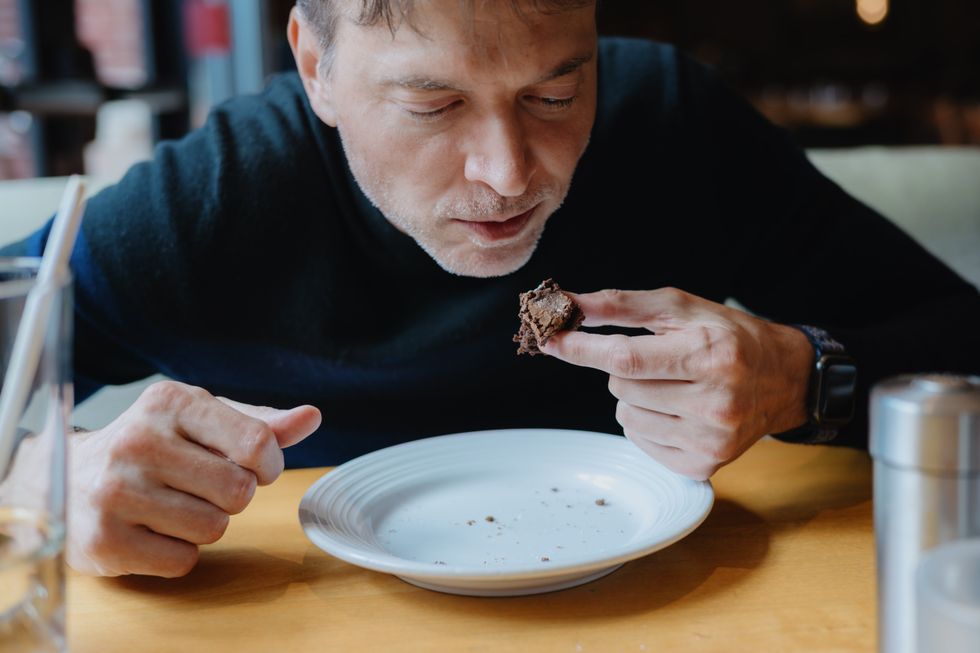 man eating meat
