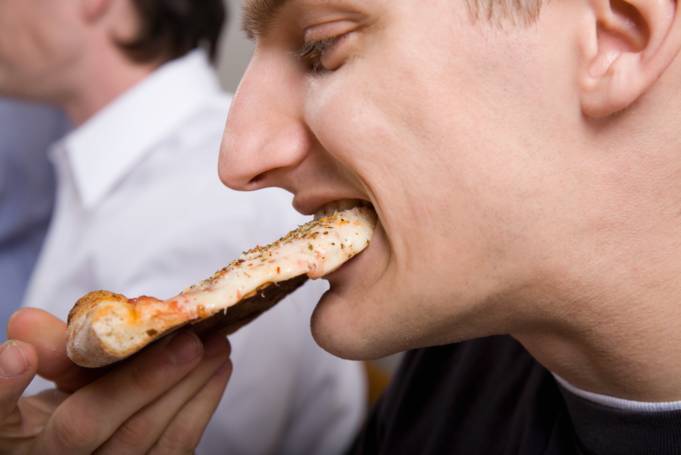 Man eating pizza