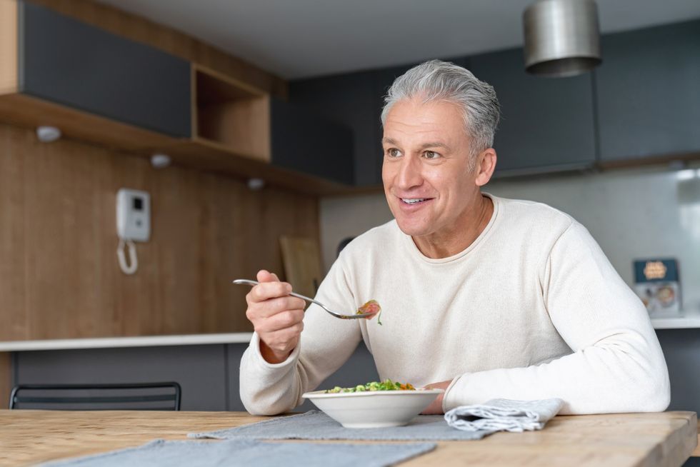 Man eating salad