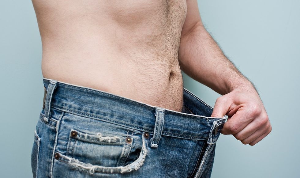 Man examining his crouch