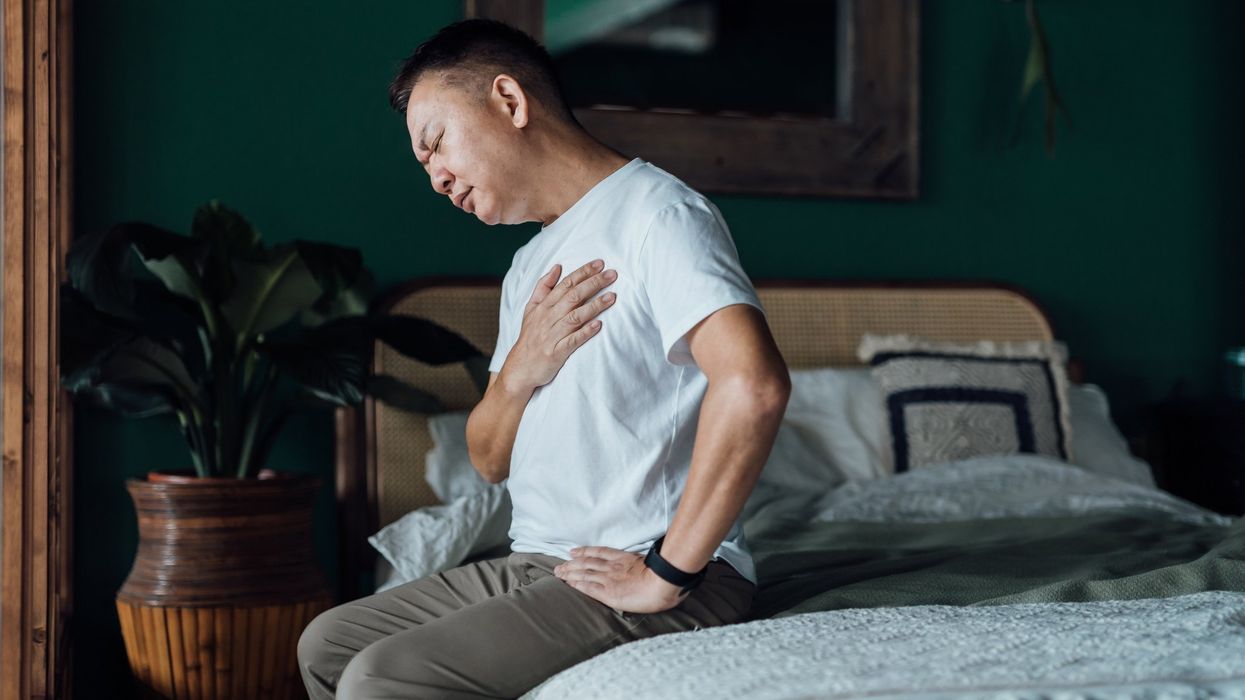 Man feeling nauseous and struggling with breathing