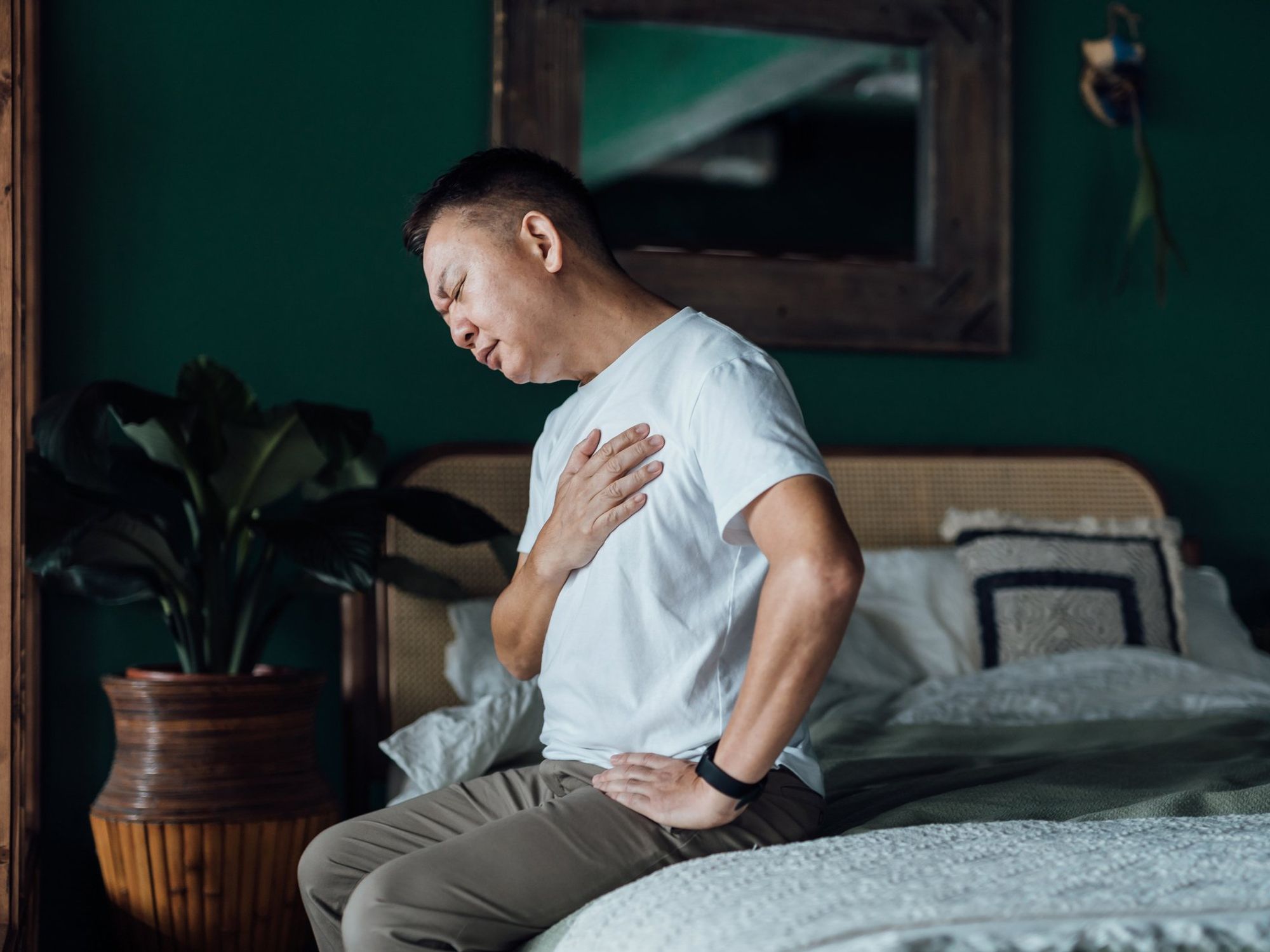 Man feeling nauseous and struggling with breathing