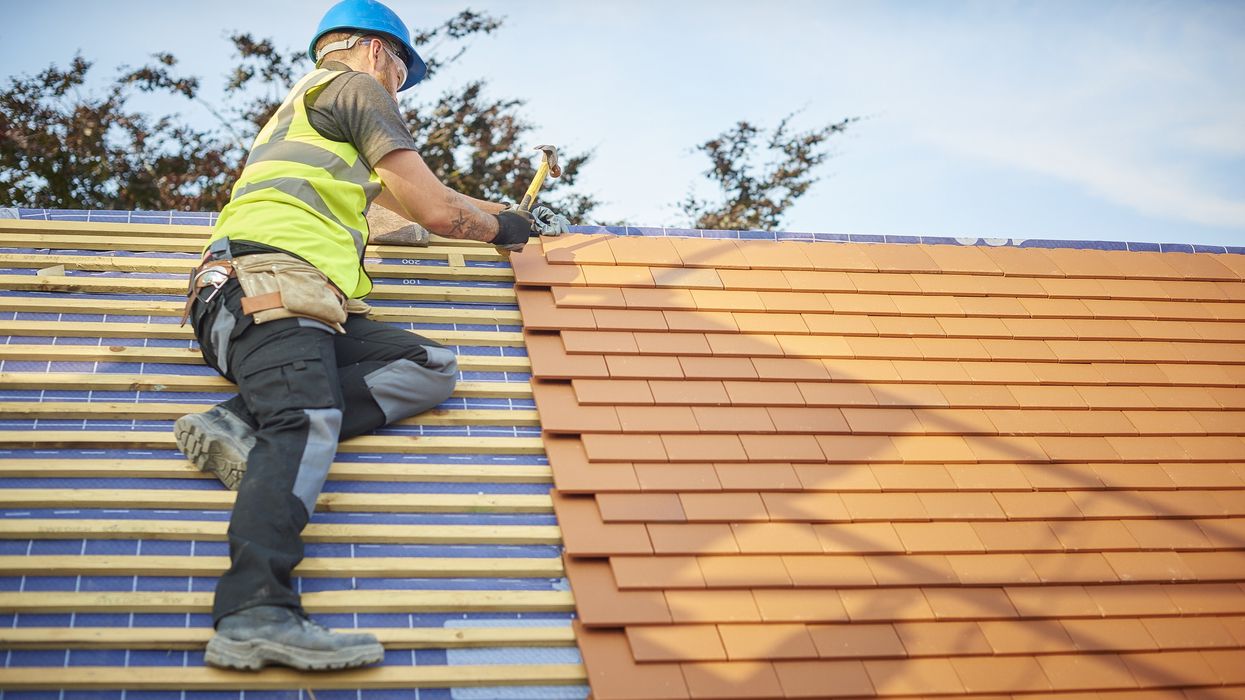 Man fixing roof
