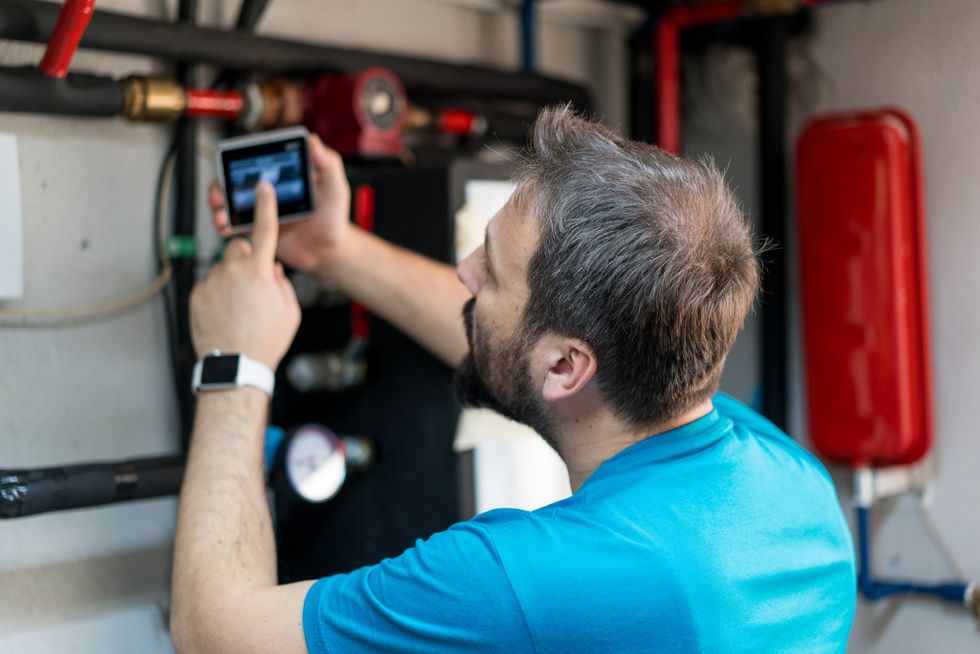 Man fixing smart meter
