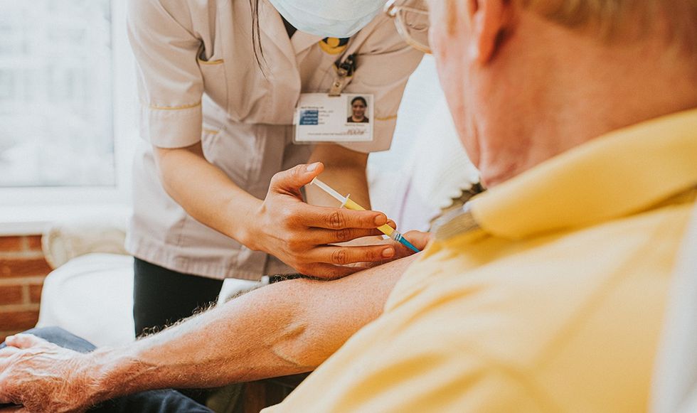 Man getting a jab in his arm
