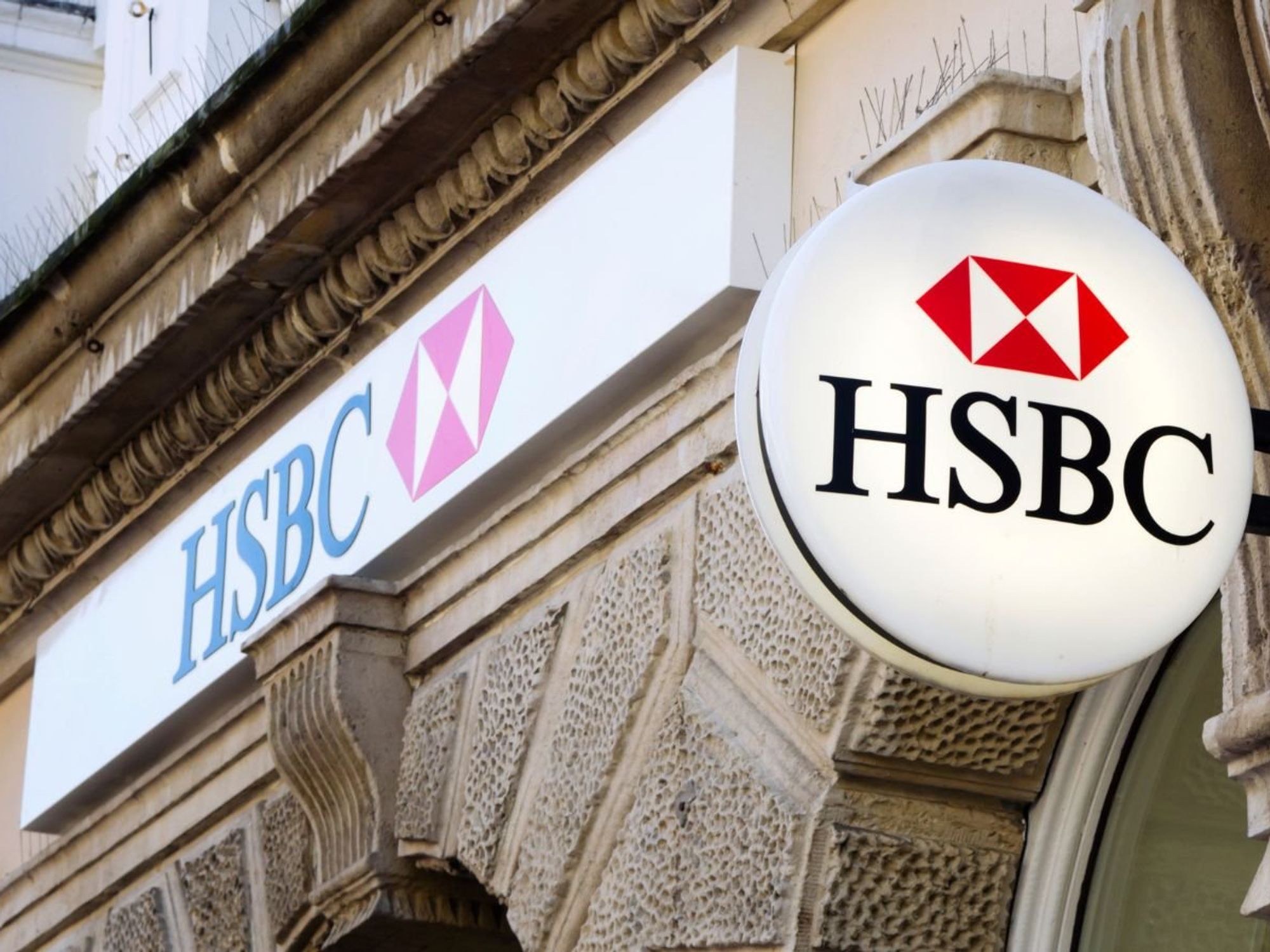 Man happy and HSBC branch