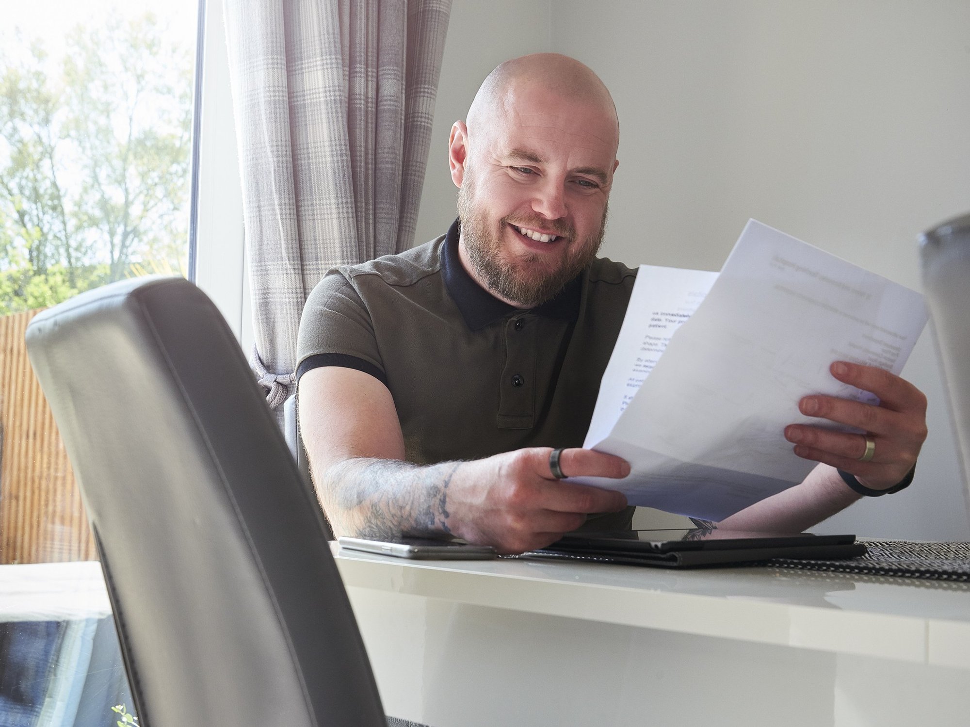 Man happy looking at bills