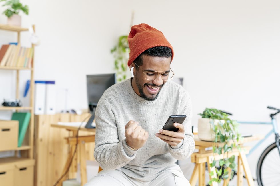 Man happy looking at phone