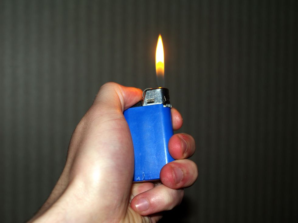 Man holding a lighter