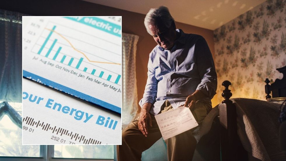 Man holding bill and energy bill