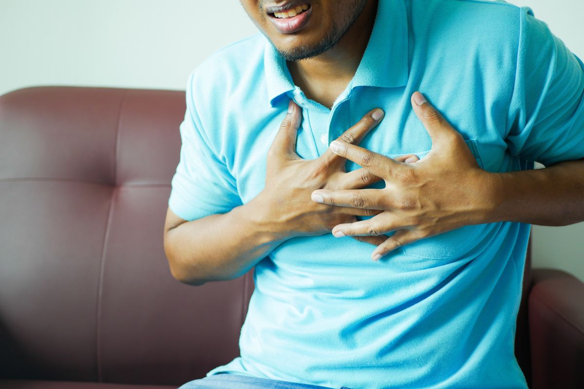 Man holding chest pain