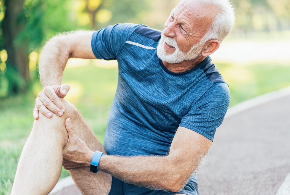Man holding his knee in pain