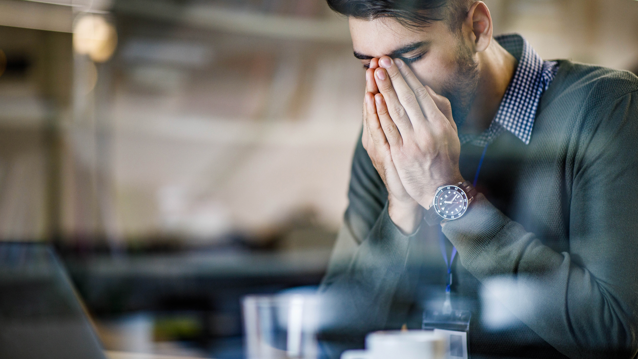 Man holding his nose