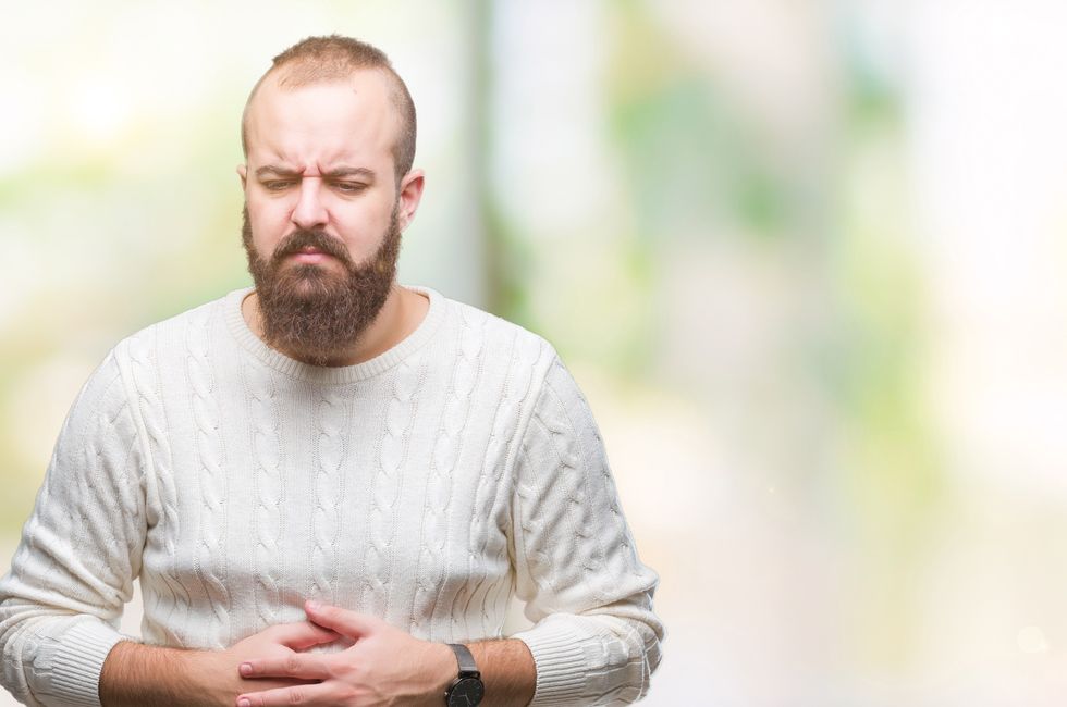 Man holding his painful stomach