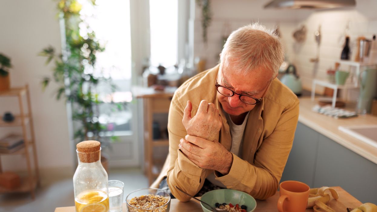 Man holding his wrist in pain