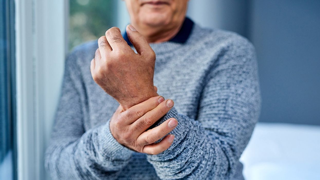 Man holding his wrist