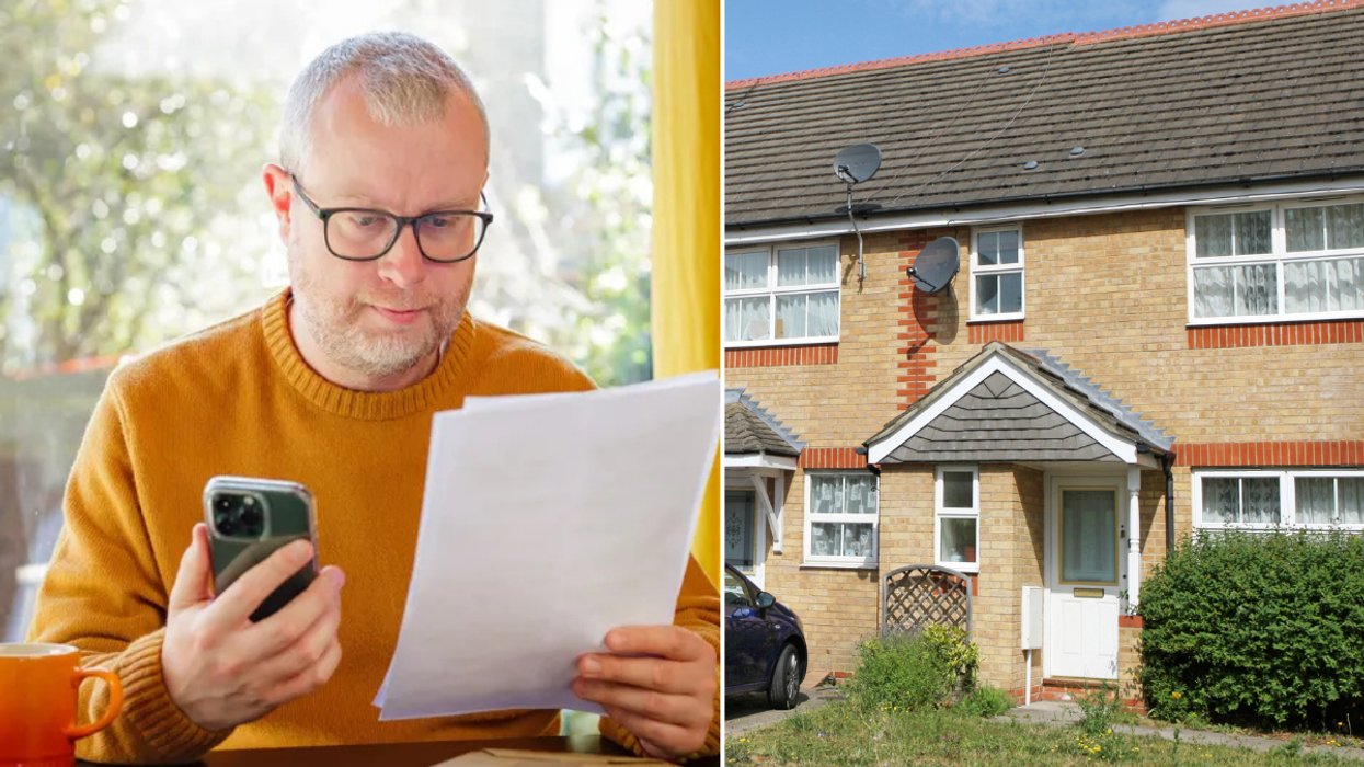 Man holding phone / house in UK