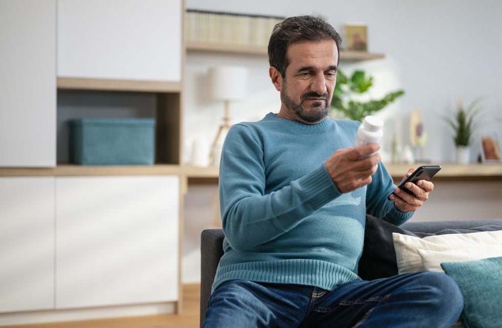 Man holding prescription bottle