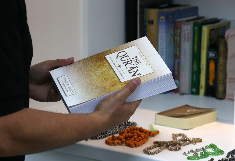 Man holding the Quran