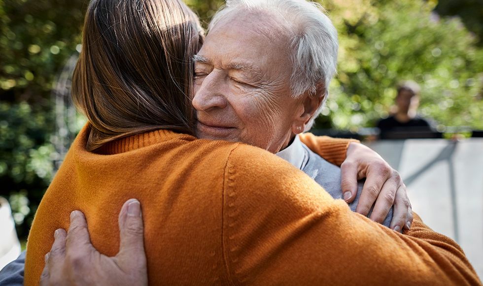 Man hugging a woman warmly