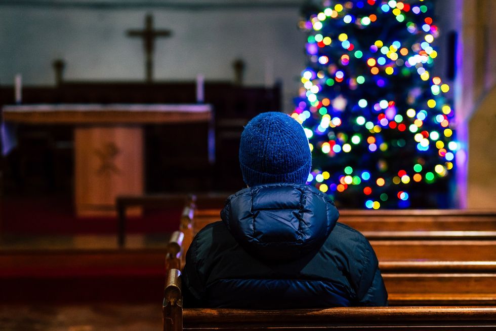 Man in Church at Christmas time