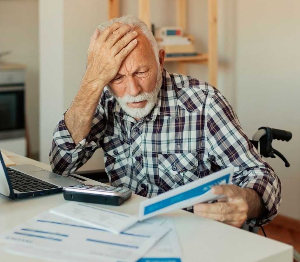Man in wheelchair looking worried