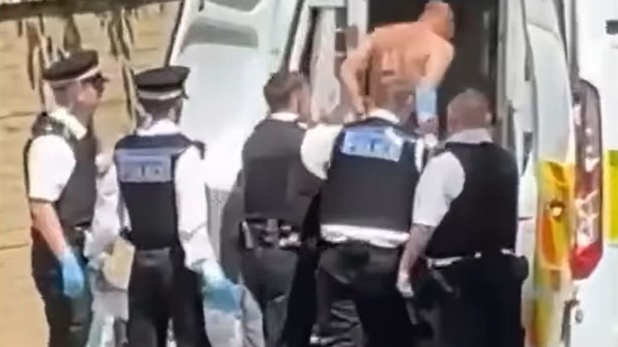 Man loaded into back of police van after allegedly damaging Lee Rigby memorial