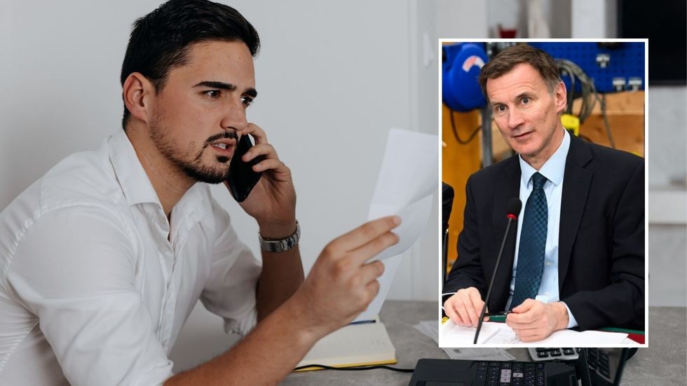 Man looking annoyed and Jeremy Hunt at event